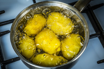 potatoes boil in water and a saucepan. place for your text.