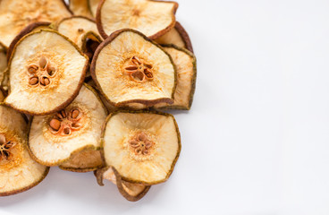 Tasty dried pear slices isolated on white background, top view