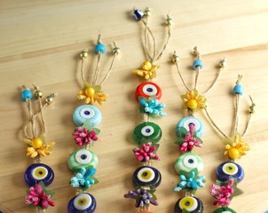 Evil eyes on the wooden background