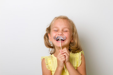 Free time for fun. Close up portrait small girl with fake mustache with plump