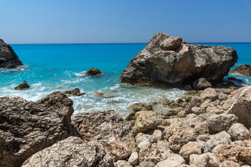 Fototapeta na wymiar Seascape of blue waters and rocks of Megali Petra Beach, Lefkada, Ionian Islands, Greece
