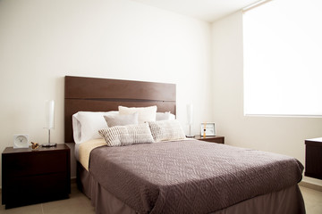 Cozy master bedroom with purple blanket