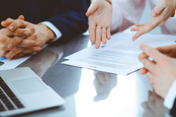 Obraz premium Group of business people and lawyers discussing contract papers. Success at meeting or negotiation