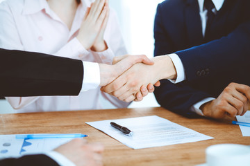 Business people shaking hands finishing up a meeting. Handshake at successful negotiation