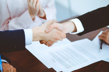 Business people shaking hands finishing up a meeting. Handshake at successful negotiation