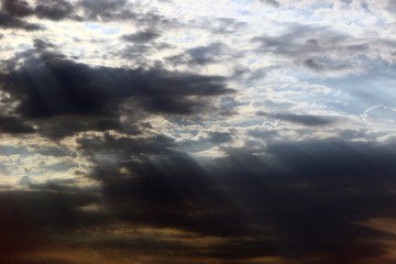 amazing vivid with sun rays partially cloudy sky for using in design as background.