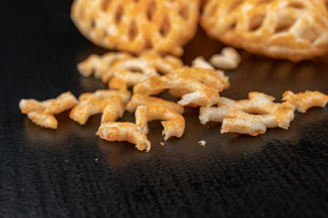 Fresh fudges on a dark kitchen table. Tasty snacks to crunch.
