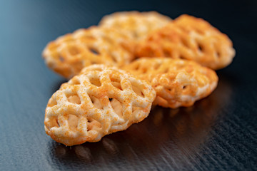 Fresh fudges on a dark kitchen table. Tasty snacks to crunch.