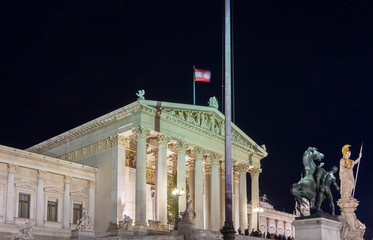 Naklejka premium The Austrian Parliament palace in Vienna at night, Austria.