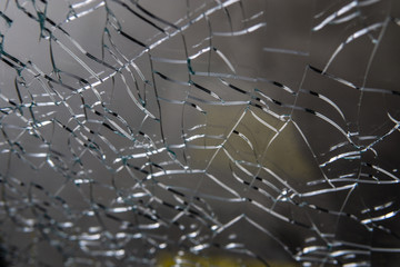 Broken glass. Web of cracks. Abstract background