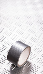 Silver duct tape on metalic background