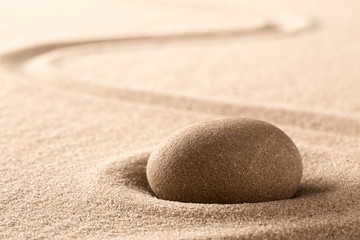 Zen meditation Japanese stone and sand garden with raked line. Concept for concentration and focus for purity, harmony and balance. Background with copy space. .