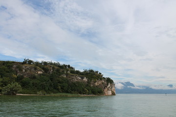 Rocky shore on lake Garda Sirmione Italy