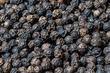 heap of black pepper texture background, milled peppercorns , dried spice pepper corn concept