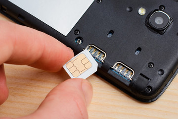 Inserting SIM card to a mobile phone