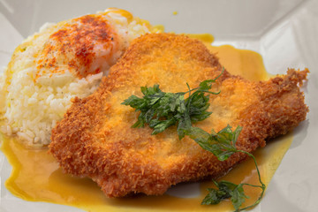 Schnitzel fried from grated potatoes and veal with butter, egg and smoked red pepper. Garnished with mustard sauce with celery.