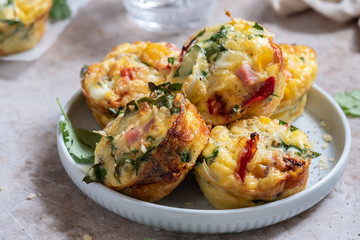Delicious egg muffins with ham, cheese and vegetables