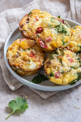 Delicious egg muffins with ham, cheese and vegetables