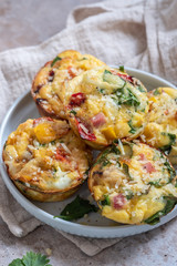 Delicious egg muffins with ham, cheese and vegetables