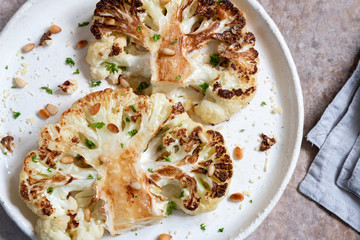 Vegetarian roasted cauliflower steak with pine nuts