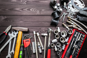 tools and auto spare parts on wooden workbench. copy space