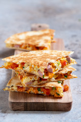 Quesadilla with scramble eggs, vegetables, ham and cheese