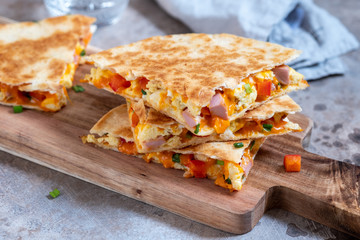 Quesadilla with scramble eggs, vegetables, ham and cheese