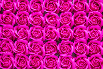 Crimson rose flower made from soap close-up background