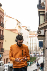 Fototapeta na wymiar Hipster Man Listening Music on Headphones.