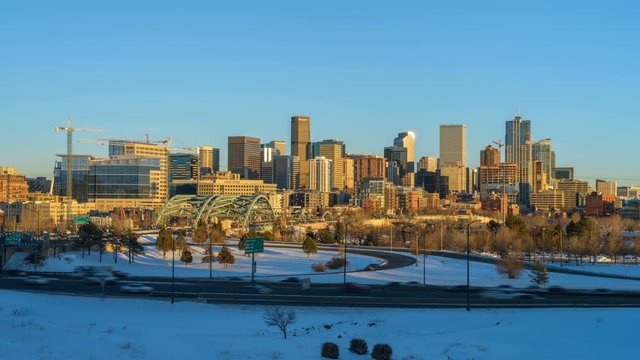 Winter Downtown Denver Skyline - A day-to-night time-lapse of panoramic winter view of Downtown Denver, looking from west side of the city, next to the busy U.S. Interstate Highway 25. CO, USA.