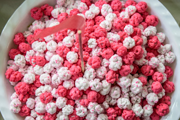 Pink and white candy a path of Chinese sweetmeat made of many ingredients ( Kanom Chan ap)
