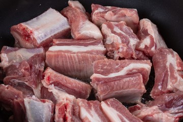 Raw food pork meat cooking,  wood  kitchen.