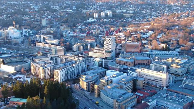 Aerial zooming into shot of Skoyen area and e18 seen towards Holmenkollen in Oslo, Norway