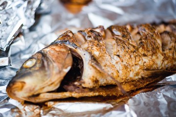 carp whole foil dinner food. fresh.
