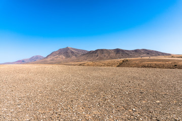 Panoramic view desert region  Playa Blanca Papagayo - White Beach Papagayo, - at volcanic island Lanzarote, Canary Islands, Spain.  Travel vacation concept.