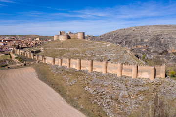 Fototapeta premium Berlanga de Duero medieval castle ruin near Soria, in the Castilla Leon region Spain with blue sky from the air