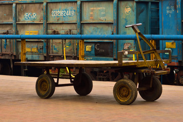 hand pulled wagon or cart on a railway platform