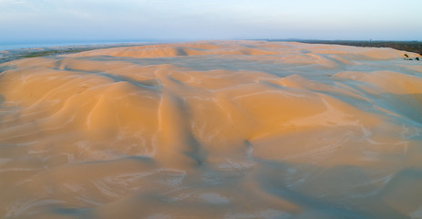 Aerial panorama of sunset over beautiful sand dunes. Anna Bay, New South Wales, Australia