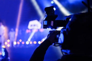 Professional TV cameraman during event recording