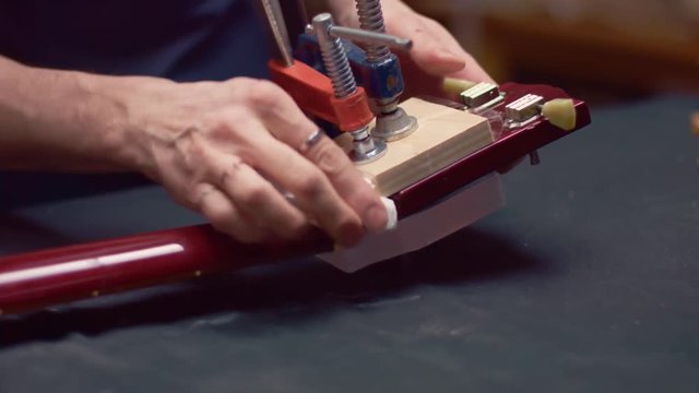 Guitarist repair headstock