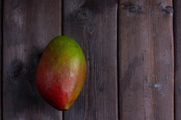 mango on a dark wooden background