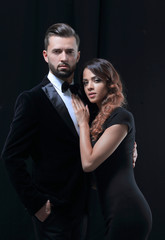 portrait of fashion couple on black background