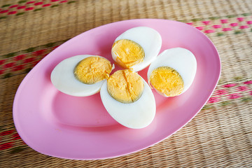 boiled egg slice on pink plate background