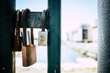 Lock. Locks on the bridge as a sign of love and loyalty.