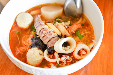 Hot and spicy thai food noodle seafood soup bowl