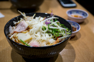 Pho Vietnamese seafood soup in the bowl