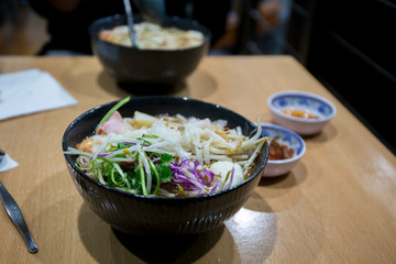 Pho Vietnamese seafood soup in the bowl