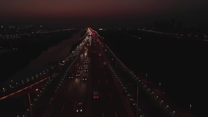 Aerial top view of highway interchange on the sunset. Aerial top view of road junction from above, automobile traffic and jam of many cars, useful for engineering, industrial, transportation concept