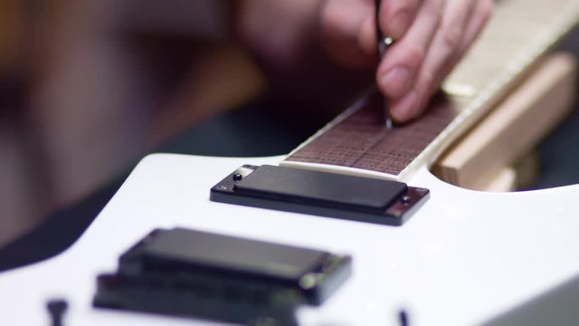 Guitar maker fix inlays white dots