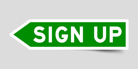 Arrow shape green color sticker in word sign up on gray background
